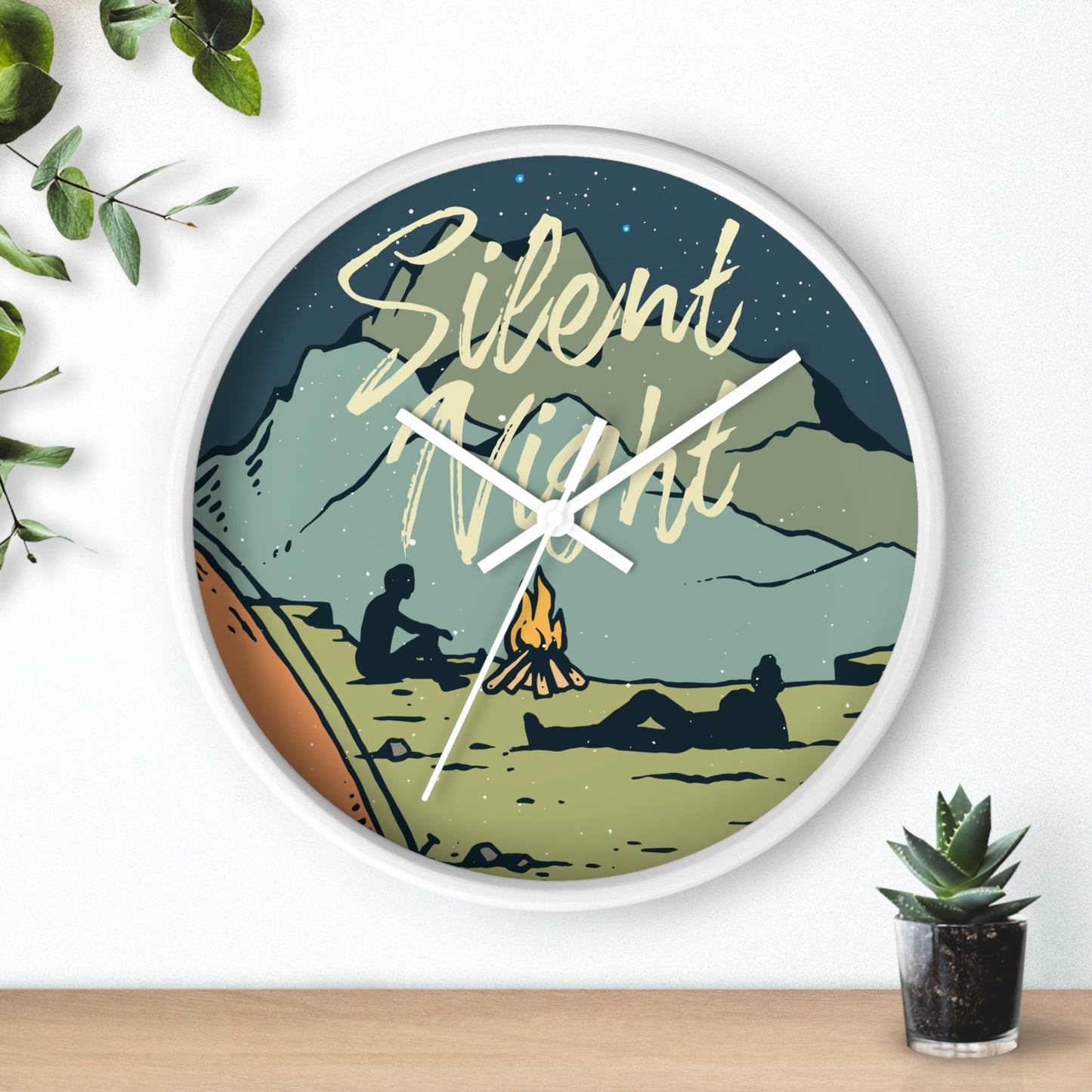 Camping wall clock hanging on wall, white frame, white hands